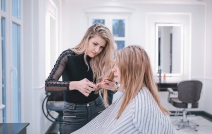 professional-stylist-doing-haircut-salon
